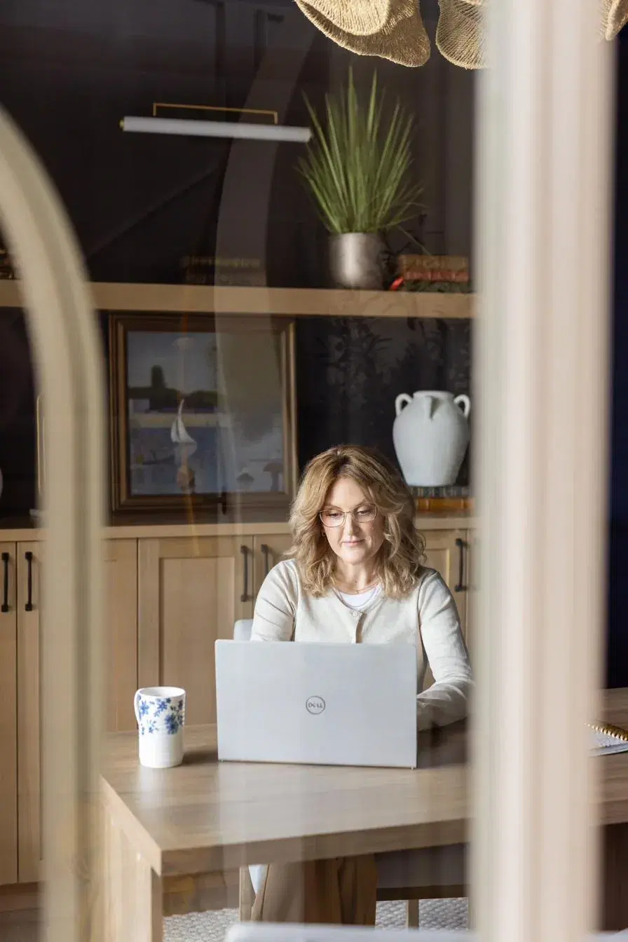 Angela Fawcett working at her desk